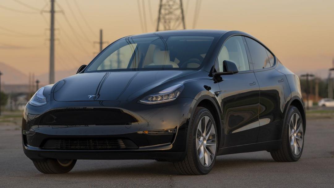 tesla-model-y-with-powerline-royalty-free-image-1673730340.jpg